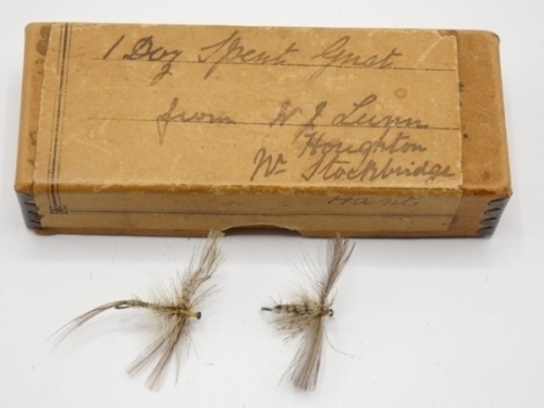 A metal edged brown card box with ink inscribed label “1 Doz. Spent Gnat from W.J. Lunn, Houghton, Nr. Stockbridge, Hants and holding two mayfly spinner flies, circa 1900