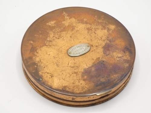 A Hardy copper cast case, cream painted interior fitted two cast compartments with felt damper pads, hinged lid with applied nickel silver oval trade plaque, 4 1/4" diam., circa 1900