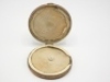 A Hardy copper cast case, cream painted interior fitted two cast compartments with felt damper pads, hinged lid with applied nickel silver oval trade plaque, 4 1/4" diam., circa 1900 - 2