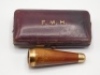 F.M.H.’s personal gold mounted cigar holder, contained within a rectangular F. Edwards & Co. burgundy leather and velvet lined fitted case, lid gilt stamped “F.M.H., the tapered fine grained wooden holder with gold mouth piece and top band, fitted case ho