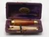 F.M.H.’s personal gold mounted cigar holder, contained within a rectangular F. Edwards & Co. burgundy leather and velvet lined fitted case, lid gilt stamped “F.M.H., the tapered fine grained wooden holder with gold mouth piece and top band, fitted case ho - 2