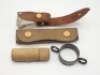 A small collection of various fly fishing accoutrements belonging to F.M.H including a leather tabbed glass dry fly oil bottle (lacking stopper), a leather line greaser, felt lined interior, twin stud fasteners, a treen shot/cap cannister and a brass net 
