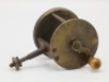 A scarce 19th Century spike fitting 2" brass winch, bulbous turned horn handle on curved crank winding arm with domed iron retaining nut, triple cage pillars, fixed check mechanism, iron block foot with square tapered spike fitting and milled circular br