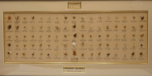 A framed Ogden Smith “Principal Patterns" shop display of eighty five trout flies, displayed within a gilt lined mount and with printed pattern detail below each fly, there is a further small, recessed section showing five graduated fly hooks and title 