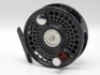 A fine Charlton Signature Series 8500 .8 trout/bonefish fly reel, black anodised right hand wind model with counter-balanced rosewood handle, knurled spool release medallion and large rear tension adjusting wheel, new/unused condition, in original; clot