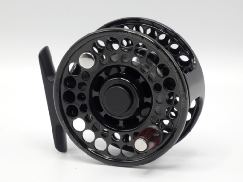 A fine Charlton 8350c configurable trout fly reel, left hand wind black anodised model with #1/5 weight spool, counter-balanced rosewood handle, push button spool release, ventilated drum and cage, rear spindle mounted tension adjuster, new/unused conditi