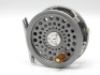 A Hardy Duchess 3" trout fly reel and spare spool, graphite anodised finish, rosewood handle, three screw spring latch, twin nickel silver “U" shaped line guides, milled rim tension screw, as new condition, in neoprene pouch and card box (see illustration