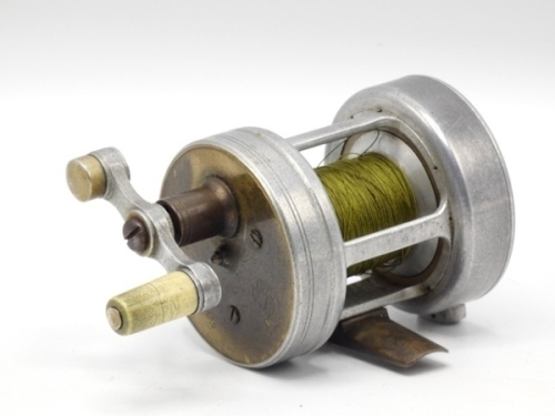 A very rare Farlow Billiken multiplying bait casting reel, alloy construction with 3:1 ratio gearing, off-set tapered xylonite handle on counter-balanced arm which disengages the spool for casting when raised and turned, brass faceplate, removeable alloy 