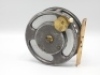 A rare Percy Wadham Carisbrooke 4" alloy bait casting reel, skeletal shallow drum with slotted core, twin ivorine handles and central brass milled locking nut, brass foot, rear plate with three large cut-away finger ports for drum braking, rim mounted bra - 2