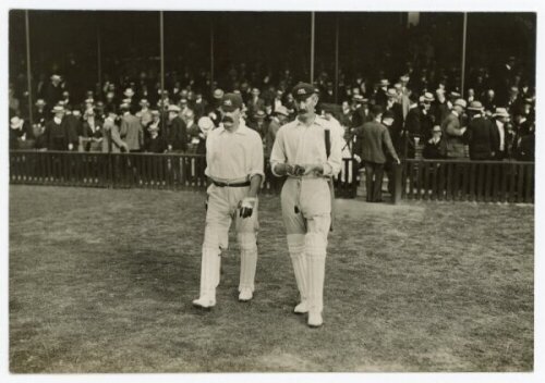 The Ashes. England v Australia 1905. Early original mono postcard size press photograph from the 1905 Ashes series of the Australian captain, Joe Darling, and Charlie McLeod walking out to bat for Australia in the fifth Test at The Oval, 14th- 16th August