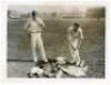 Surrey C.C.C. 1914. Two original mono press photographs of Surrey players practising in the nets at The Oval in 1914. One photograph, with accompanying original press cutting, depicts 'Brother Recruits for Surrey', Miles and John Howell, Miles padding up 