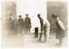 George Burton and J.T. 'Old Jack' Hearne. Middlesex. Two original mono photographs taken at the indoor nets at Hampstead Baths, Finchley Road, London, one of Burton in batting stance at the wicket with ladies looking on, the other of Hearne bowling to 'Wa