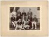 John William Henry Tyler Douglas. Essex, London County & England 1901-1928. Original mono photograph of a cricket team seated and standing in rows wearing an assortment of blazers, a corrugated pavilion in the background. J.W.H.T. Douglas is seated on the - 2