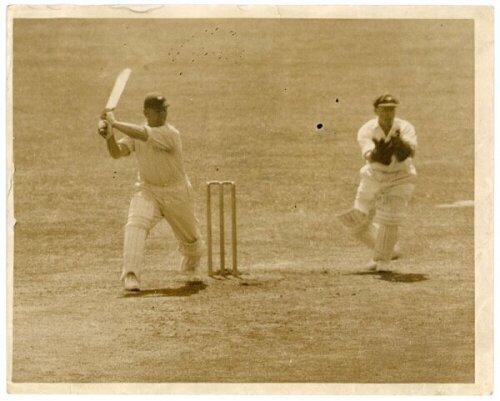 The Ashes. England tour to Australia 1928/29. Two original sepia press photographs, one of Maurice Leyland playing a cover drive in England's first innings of the fifth Test, Melbourne, 8th- 16th March 1929 (timeless Test). Central Press Photos, 10"x8". T