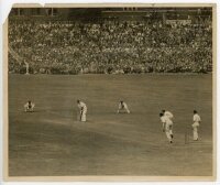 The Ashes. England v Australia 1938. Large original sepia press photograph of the first Test at Trent Bridge, 10th- 14th June 1938, in progress. Jack Fingleton of Australia is facing the bowling of Ken Farnes, with a packed grandstand in the background. C