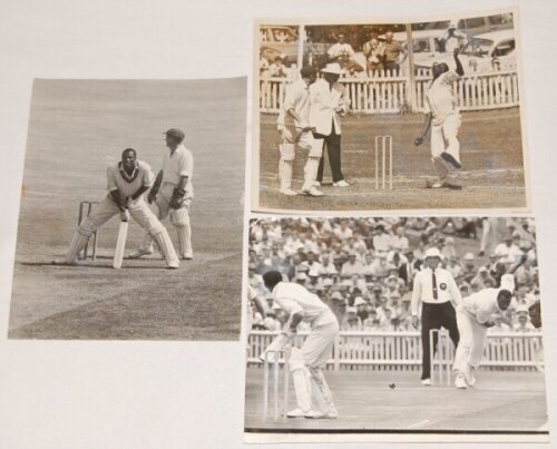 Wesley Winfield 'Wes' Hall. Barbados, Trinidad, Queensland & West Indies 1955-1970. Three original mono press photographs of Hall in match action, one having completed an unorthodox shot while batting for Queensland v New South Wales at Sydney, 1961/62, b