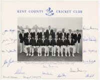 Kent C.C.C. c.1966/67. Official mono printed photograph of the Kent team seated and standing in rows wearing Kent blazers. Fully signed in ink to the borders by all sixteen featured players. Signatures include Cowdrey (Captain), Leary, Denness, Dixon, Wil