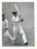 Don Bradman. Modern copy photograph of Bradman descending pavilion steps through the crowd, boldly signed in blue ink in later years by Bradman. 4"x6". Sold with an original mono press photograph of Bradman in batting action for Australia v Worcestershire - 3