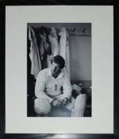 'Ian Botham 1981'. Excellent large 'Getty images' mono photograph of England hero enjoying a well earned cigar in the dressing room after his match winning performance against Australia in the historic Headingley Test at Leeds. The photograph attractively