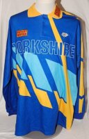 Mark Andrew Robinson (Northamptonshire, Canterbury, Yorkshire and Sussex 1987-2002). Blue Yorkshire 'Axa' Sunday League shirt with yellow trim by Hogger Sports. 'Yorkshire', white rose emblem and 'Tetley Bitter' sponsor's logo to front. Player's name and 
