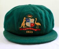 Ronald Graham Archer. Queensland & Australia 1951/52-1958/59. Australian dark myrtle green wool test cap worn by Ron Archer during the Australian Test tour of England in 1953. The cap, by Farmers of Sydney, embroidered with the Australia emblem and below 