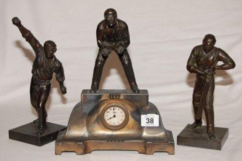 Charles Burgess Fry, Sussex & England 1892-1921. Victorian spelter three piece clock garniture featuring C.B. Fry. The clock cast with a wicket keeper atop it, flanked by Fry as a bowler and Fry as a batsman, celebrating Fry as the great English all round