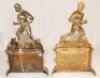 A pair of unusual Victorian brass sporting fire dogs/andiron figures. One depicts a footballer kicking a ball, the other a rugby player running with the ball, both players wearing caps. The figures stand on fireplaces each of which is decorated to centre - 2