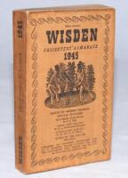 Wisden Cricketers' Almanack 1945. 82nd edition. Original limp cloth covers. Only 6500 paper copies printed in this war year. Some soiling/ age toning to cover edges and spine paper, minor soiling to page block edge. Good+ condition. Rare war-time edition 