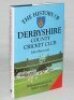 'The History of Derbyshire County Cricket Club'. John Shawcroft. Christopher Helm, Bromley 1989. Hardback with dustwrapper. Signed to the front and rear endpapers by forty six players, and to internal pages by two players, five signature on pieces laid do