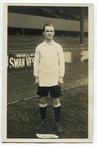 Frederick Ingram Walden. Tottenham Hotspur 1913-1924. Mono real photograph postcard of Walden, full length, in Spurs attire in front of the stand. Jones Bros of Tottenham to corner of verso. Name 'F. Walden' in box to lower border. Postally unused. Very g