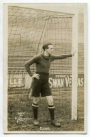 Herbert Blake. Tottenham Hotspur 1921-1924. Sepia real photograph postcard of goalkeeper Blake, full length, in Spurs attire leaning on the goal post. W.J. Crawford of Edmonton. Postally unused. Very good condition - football<br><br>Herbert Blake joined T