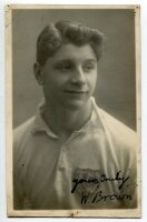 W (?) Brown. Tottenham Hotspur c1920's. Mono real photograph postcard of Brown, head and shoulders, in Spurs shirt. Signed in ink 'Yours truly, W. Brown'. W.J. Crawford of Edmonton postcard. Postally unused. Small pin holes to top corners and to lower cen