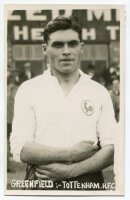 George William Greenfield. Tottenham Hotspur 1931-1935. Mono postcard size real photograph of Greenfield, half length, in Spurs shirt. Printed title to lower border 'Greenfield:- Tottenham. H.F.C.'. Photograph by Albert Wilkes & Son of West Bromwich, with