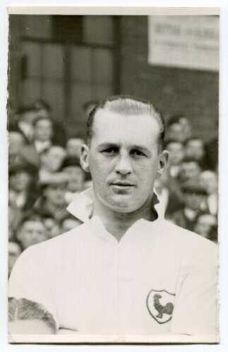 Ralph Ward. Tottenham Hotspur 1936-1946. Mono postcard size real photograph of Ward, head and shoulders, in Spurs shirt. Printed title to back of card 'Ward. Tottenham. H.F.C. 1938'. Photograph by Albert Wilkes & Son of West Bromwich, with stamp to back. 