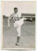 Colin Chad Lyman. Tottenham Hotspur 1937-1945. Mono real photograph of Lyman, full length on the pitch, in rarer Spurs away striped shirt. Printed title to back of card 'C. Lyman. Tottenham. H.F.C. 1937'. Photograph by Albert Wilkes & Son of West Bromwich