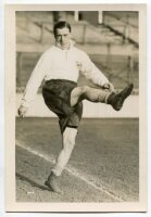 Andy Duncan. Tottenham Hotspur 1934-1943. Mono postcard size real photograph of Duncan, on the field kicking a ball, in Spurs attire. Typed name to verso. Photograph by City Press, with stamp to back. 4"x6". Very good condition - football<br><br>Duncan jo