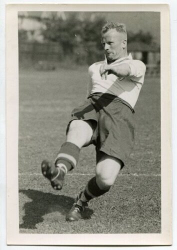 Joseph Meek. Tottenham Hotspur 1935-1939. Mono postcard size real photograph of Meek, on the field kicking a ball, in Spurs attire. Typed name to verso. Photograph by City Press, with stamp to back. 4"x6". Very good condition - football<br><br>Joe Meek pl