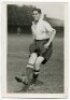 George Edward Henry Skinner. Tottenham Hotspur 1938-1947. Mono postcard size real photograph of Skinner, practising on the pitch, in Spurs attire. Name typed to verso. Photograph by City Press, with stamp to back. 4"x6". Very good condition - football<br>