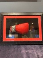 A Framed, Signed Glove by Former Heavy Weight World Champion, Frank Bruno