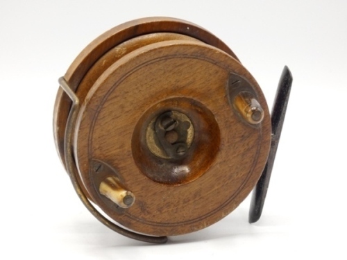 A Hardy Nottingham 4" walnut centre pin reel, solid drum with twin tapered horn handles, central spindle recess with brass telephone drum latch, Bickerdyke line guide, starback foot with sliding check button and calliper spring mechanism, foot stancheon 