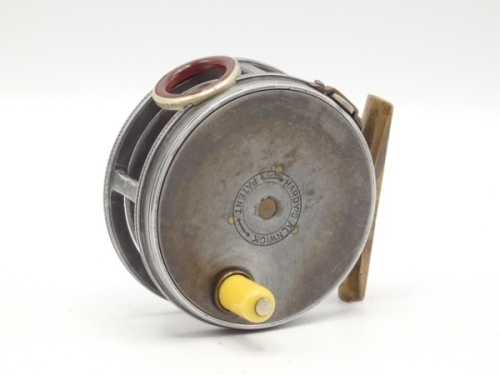 A Hardy Perfect 2 7/8" trout fly reel and block leather case, converted to left hand wind model, ivorine handle, (later) brass foot, replacement frame, red agate line guide (no cracks), strapped rim tension screw and 1906 calliper spring check mechanism, 