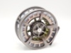 A fine Sage Spectrum Max 10/12 saltwater big game fly reel and spare spool, large arbour model with silver anodised finish, counter-balanced handle, skeletal frame, milled drum locking nut and rear graduated spindle mounted tension adjuster, as new condit - 2