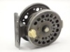 A scarce Richard Carter Aerial Firefly 2 ¾" No.6 trout fly reel and block leather case, shallow cored drum with ventilated flanges, counter-balanced ivorine handle and spring release fork, rear ivorine tension adjuster, brass line guide, distressed leaded - 2