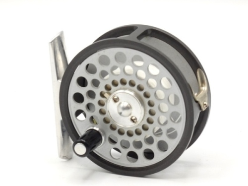 A Hardy Flyweight 2 ½" trout fly reel, composition handle, alloy foot, two screw spring drum latch, fixed check, only very light use in zip case and card box and a Farlow Sharpe "Midge" 2 piece cane brook trout rod, 6', #4/5, crimson whippings, sliding 