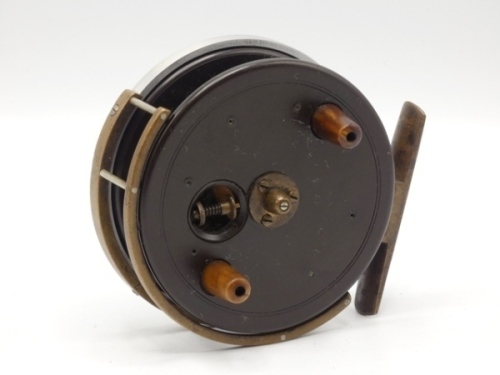 A rare Allcock Britannia 3 ½" centre pin reel, caged ebonite drum with twin tapered horn handles, milled tension adjusting regulator/release latch and raised three screw spindle boss, B.P. line guide, alloy backplate with brass foot, rear sliding optional
