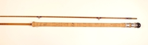 A scarce B. James "Grebe" 2 piece carp stalking rod, 8'6", crimson inter-whipped, sliding alloy reel fittings, agate lined butt and tip rings, suction joint, "donut" cork handle and England transfer label, rod actually measures 8'8" including butt cap but