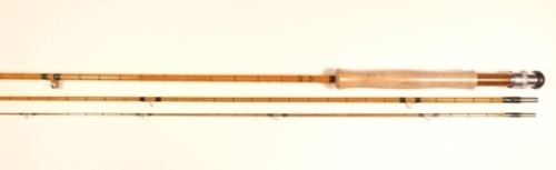 A scarce Hardy "Factory Pattern Rod No.87" 3 piece trout fly rod, 8'6", #6, green/scarlet tipped wraps, scarlet silk inter-whippings, wooden reel seat with alloy screw grip reel fitting, agate lined butt and tip rings, suction joint, in bag and with plas