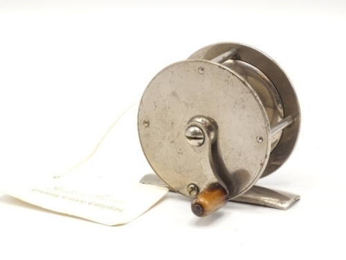 A 19th Century nickel silver 2 ¼" crank wind trout winch, tapered horn handle on curved crank winding arm with domed retaining screw, block foot, triple cage pillars, fixed check mechanism, circa 1870
