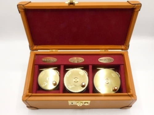 A set of Three Hardy 1902 reproduction limited edition Brass Faced Perfect wide drummed trout fly reels, sizes 2 5/8", 3" and 3 ½", numbered 043/250, each with ivorine handle, brass foot, strapped rim tension screw and early calliper check mechanism, dr