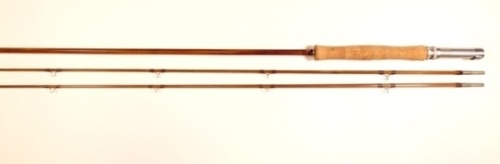An Orvis "Light Salmon" 2 piece (2 tips) impregnated cane single handed salmon fly rod, 9'6", mid-tan silk wraps, alloy screw grip reel fitting, short butt extension, suction ferrule, serial numbered "42561", snake rings, only light use, in bag and alloy